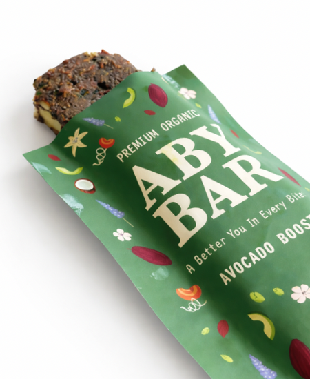 Avocado chocolate snack bar made with dates, nuts, seeds, and cacao